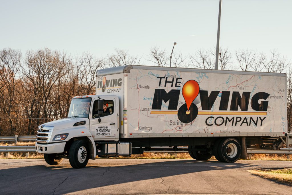 side view the moving company truck parked