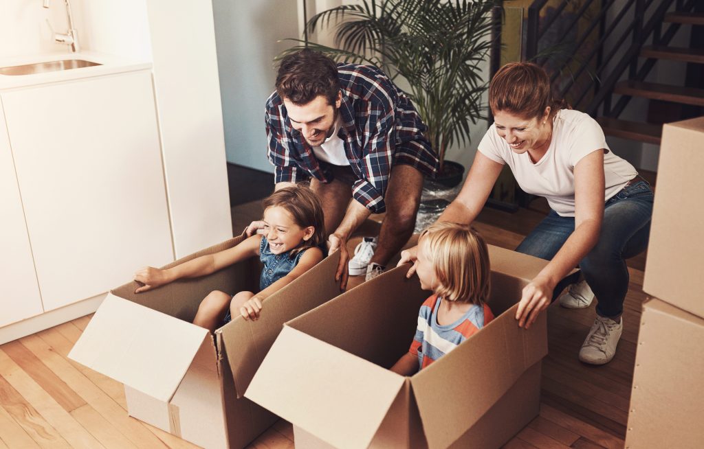 Happy family preparing to move to a new residential home